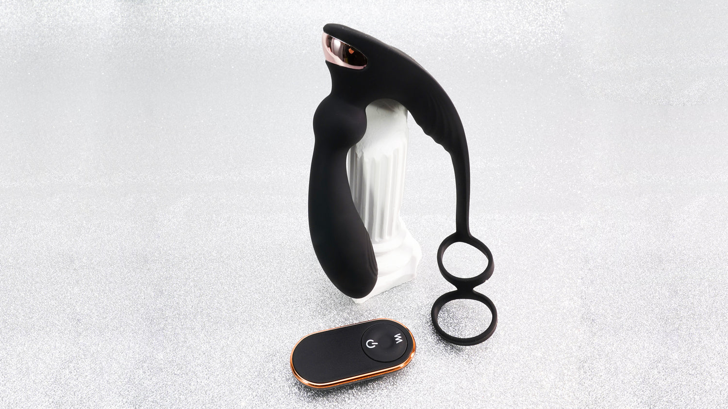 A black adult toy with a unique design, accompanied by a remote control.