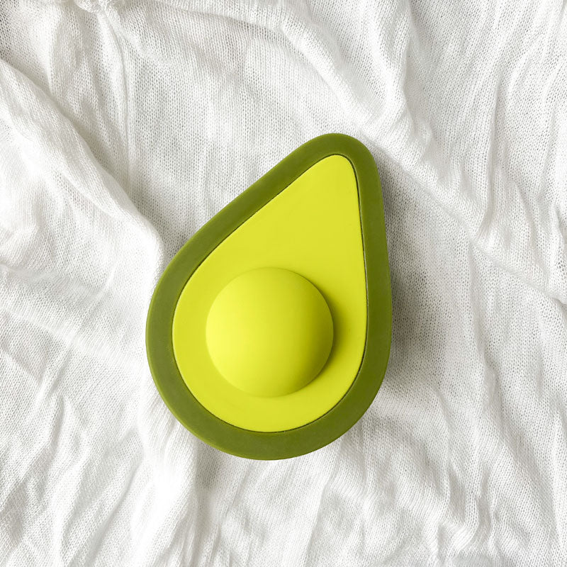 Avocado Love Egg vibrator on white fabric