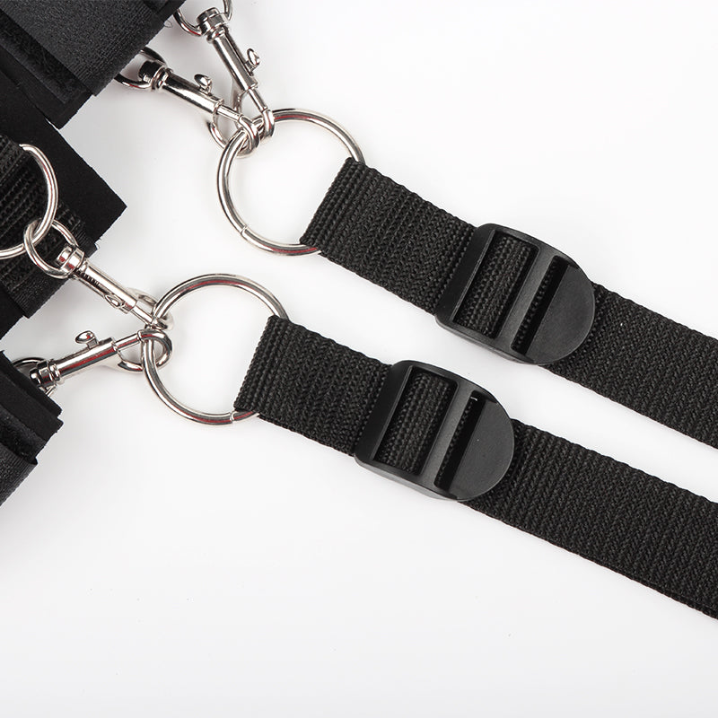 Close-up of black bondage restraints with clasps