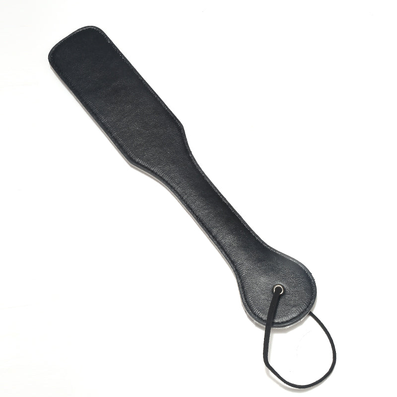 Black leather spanking paddle for sensual play