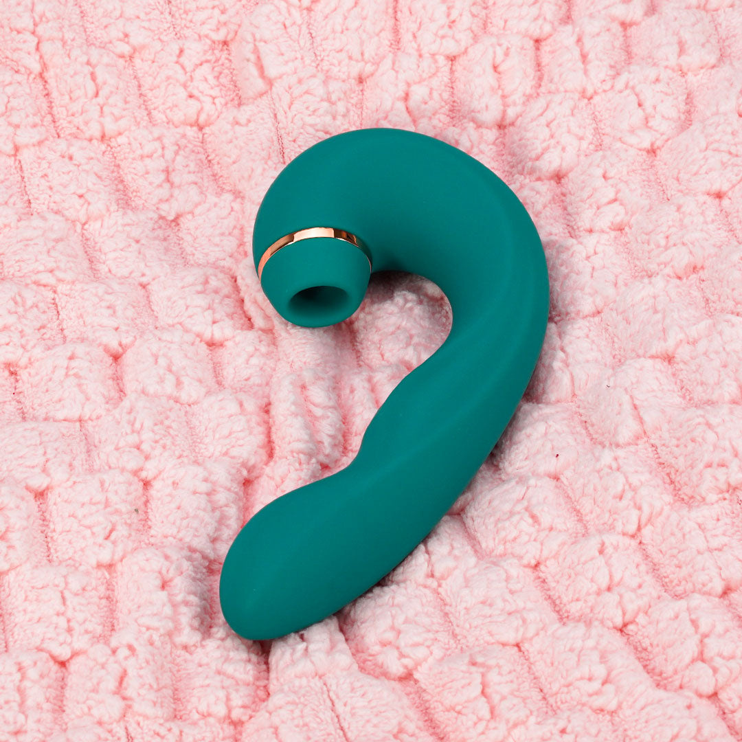Mappy Hour Teal Vibrator on Pink Textured Surface