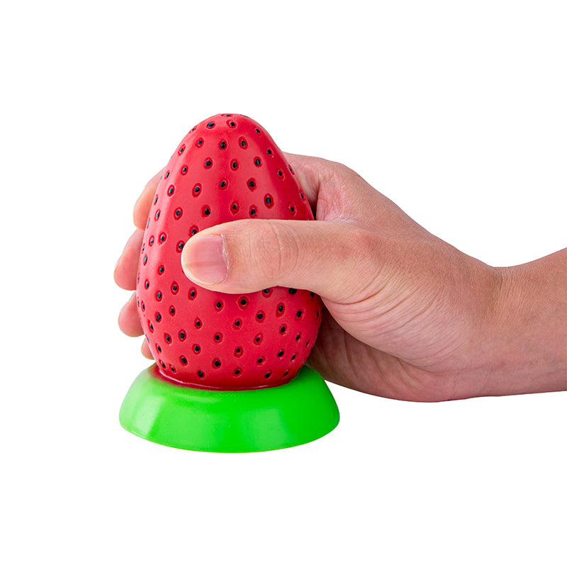 Fun strawberry dildo held in hand, Bad Peach