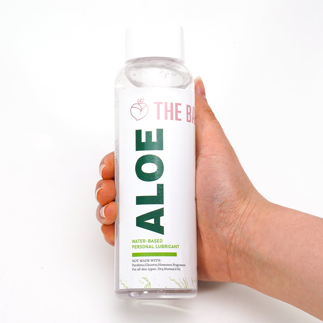 Aloe Water-Based Personal Lubricant bottle held by hand