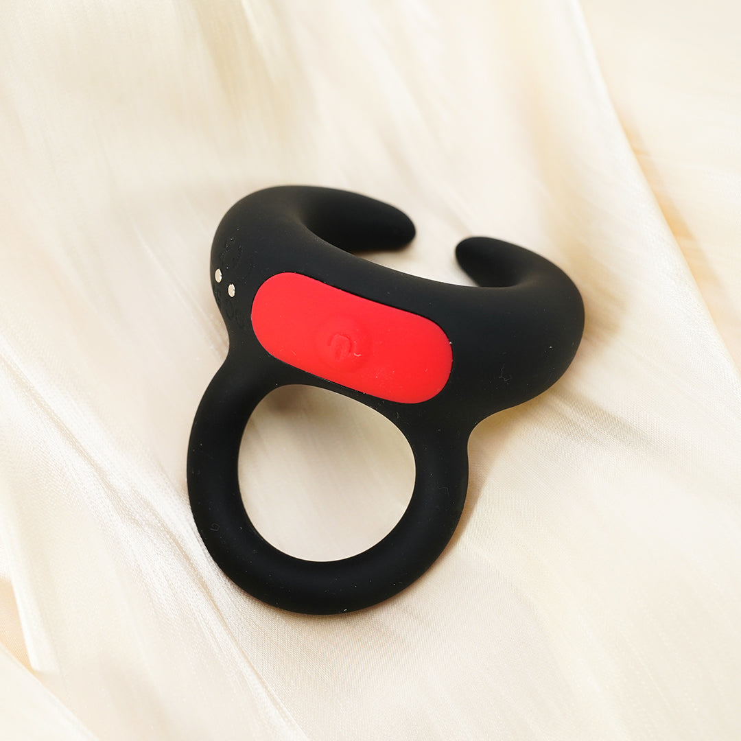 Black silicone cock ring with red power button
