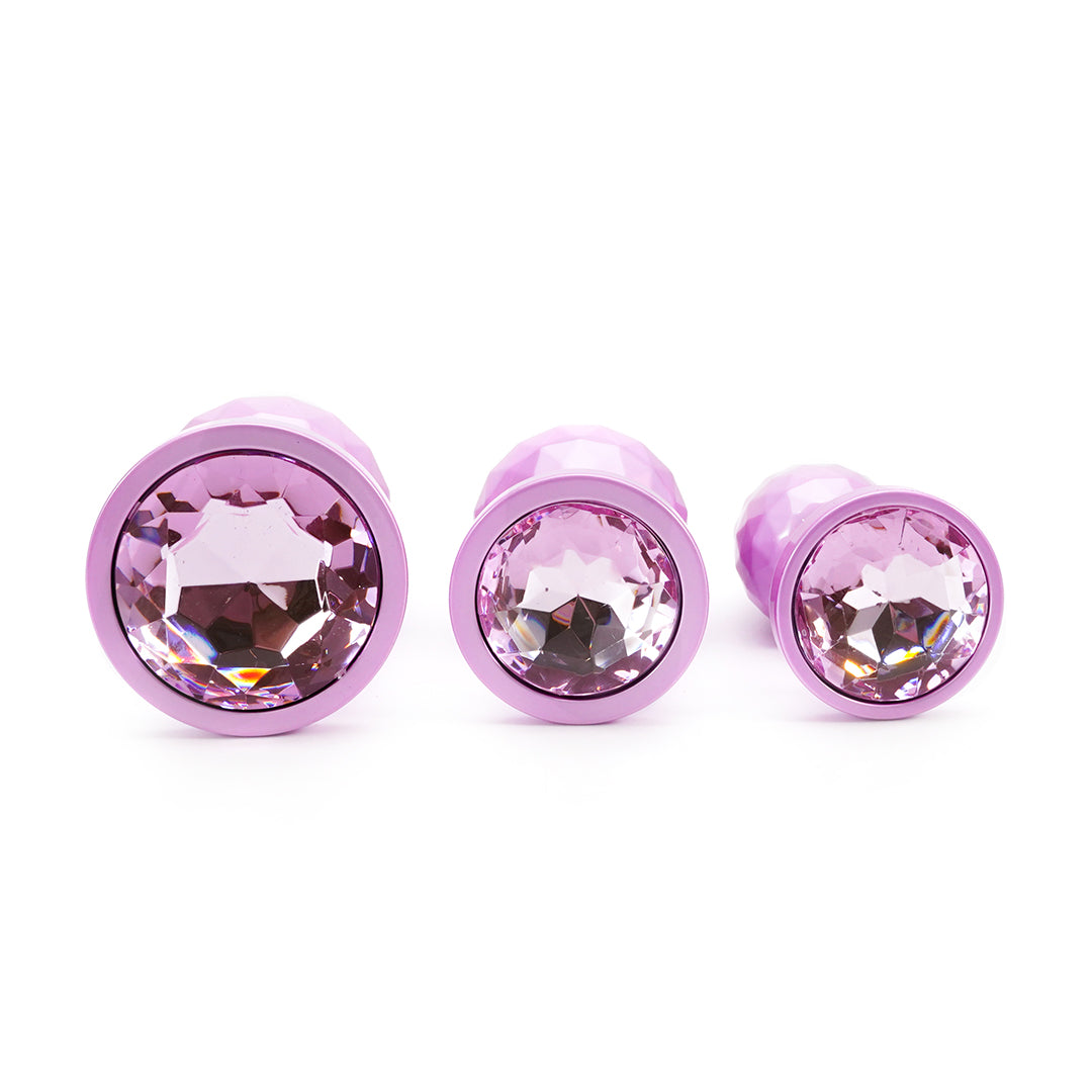 Pink metal butt plug set with jewel design. 3 piece set.
