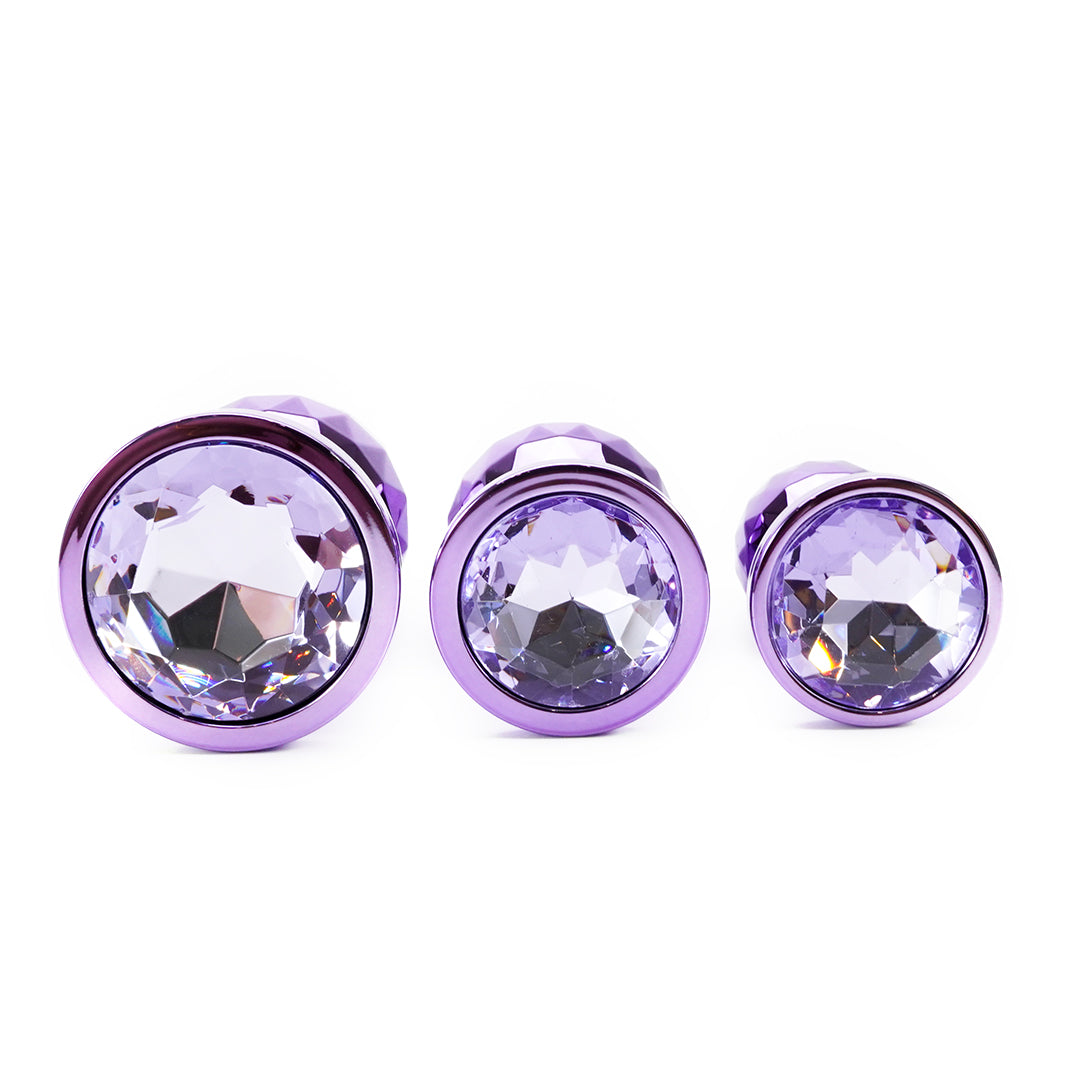 Purple metal butt plug set with crystal-like center