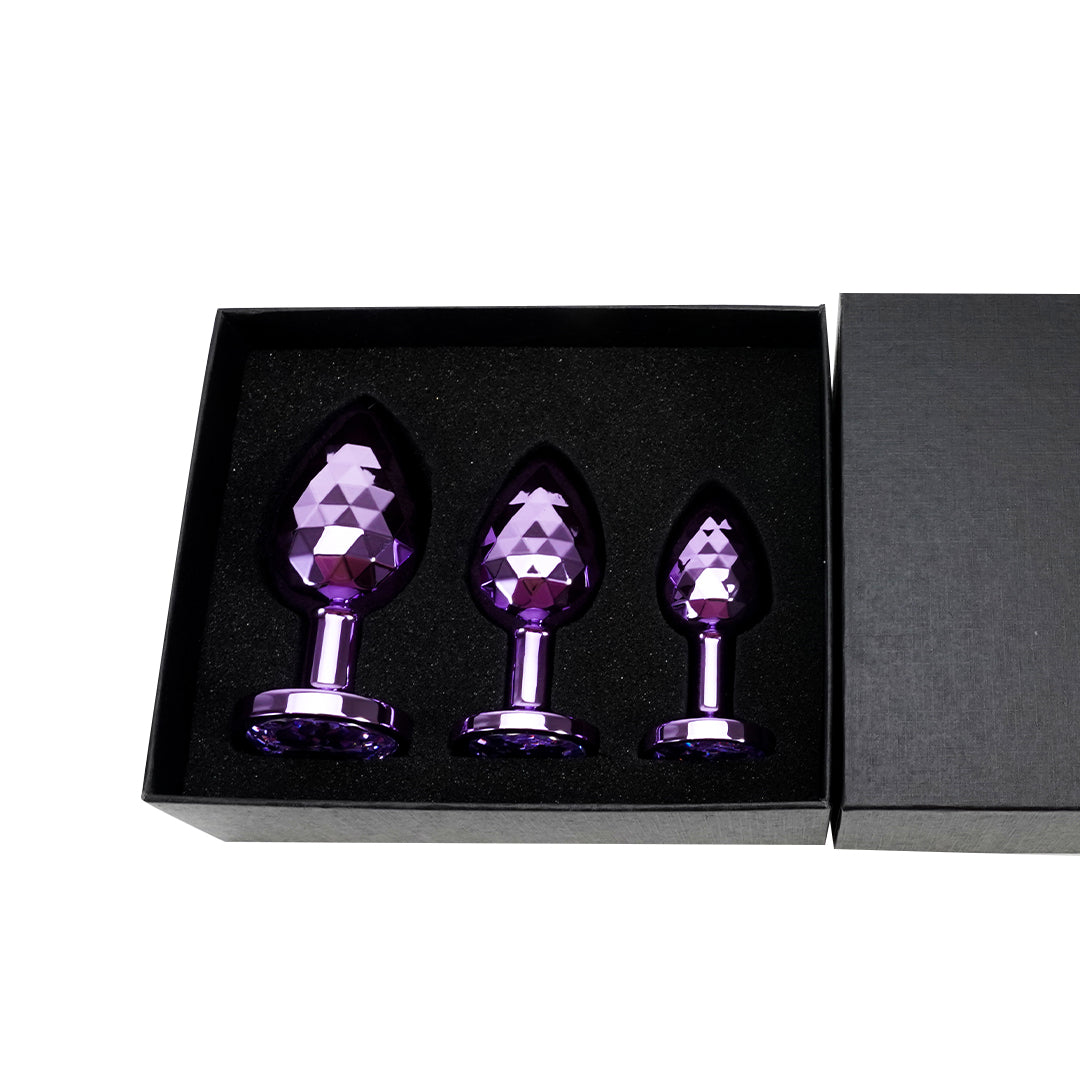 Purple metal butt plug set in a box