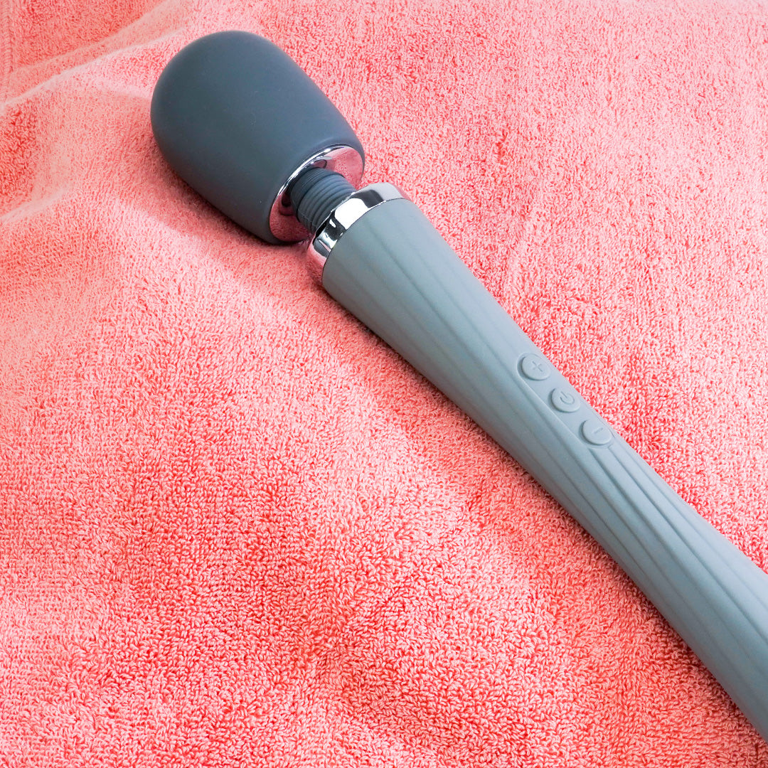 Gray Staff Extra Powerful Massage Wand Vibrator on pink towel