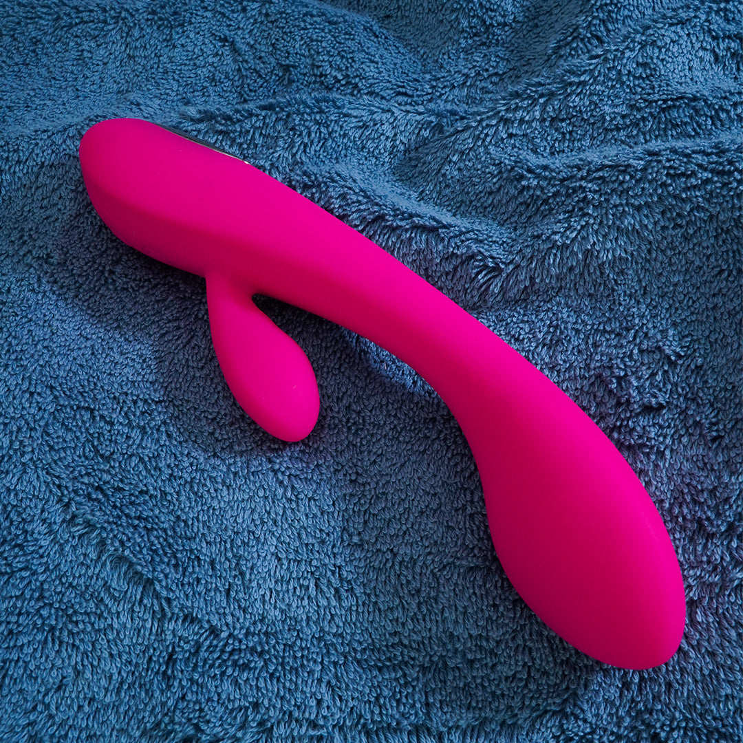 Pink rabbit vibrator on blue fabric