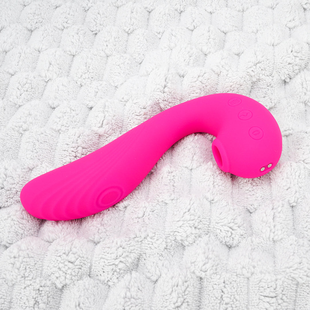 Pink Angel's Wings 3-in-1 vibrator on soft background