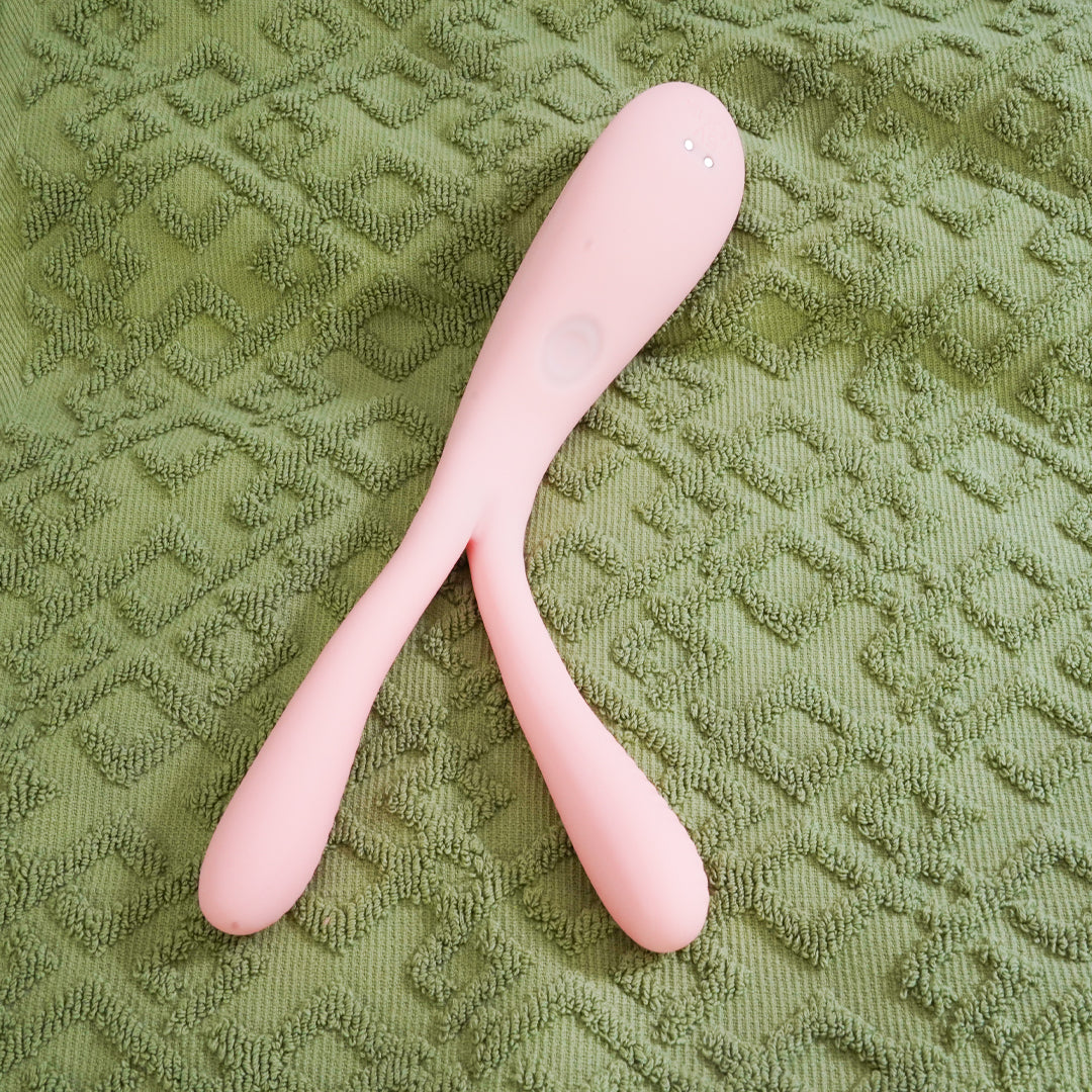 Pink rabbit vibrator on green towel
