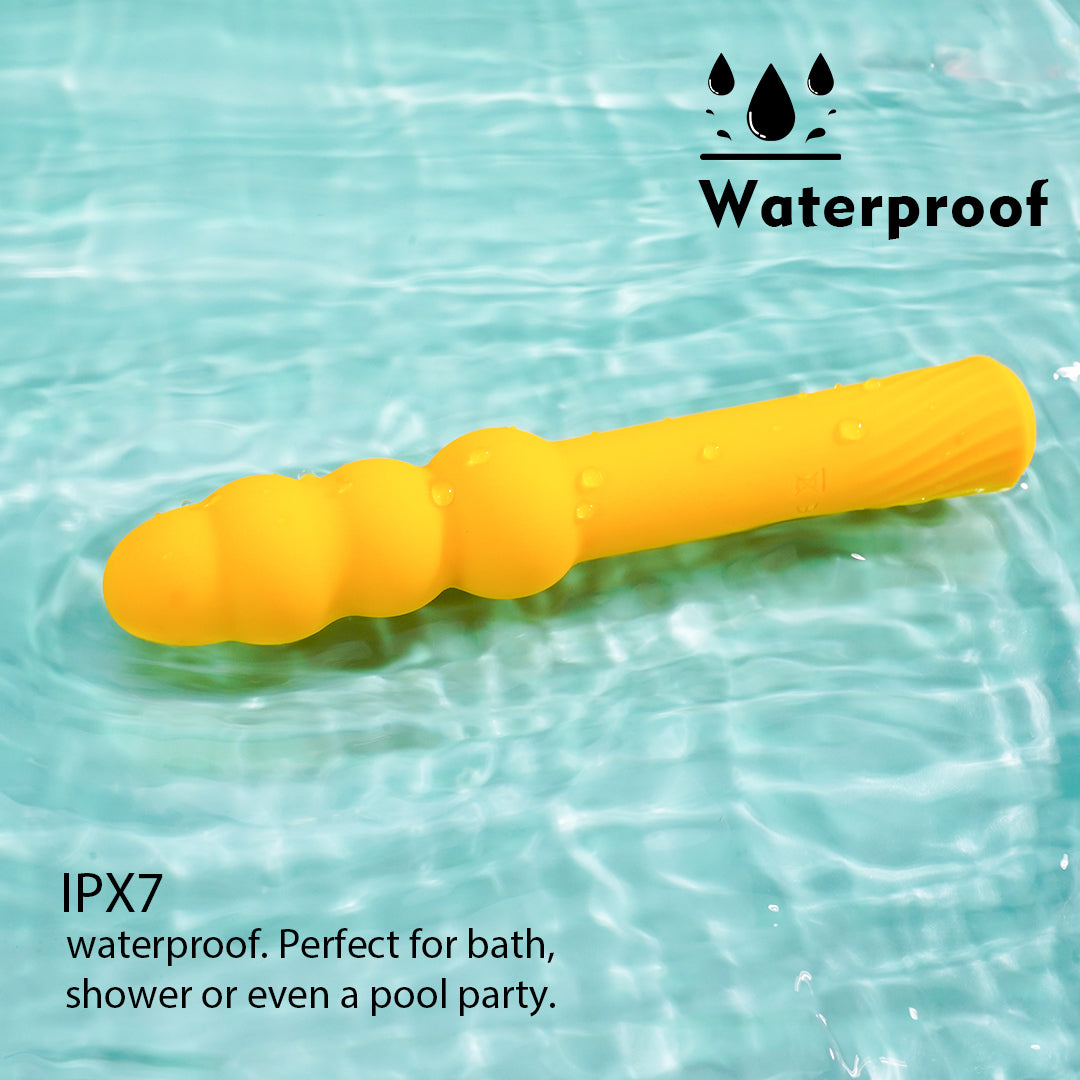 Yellow G-spot vibrator in water, waterproof