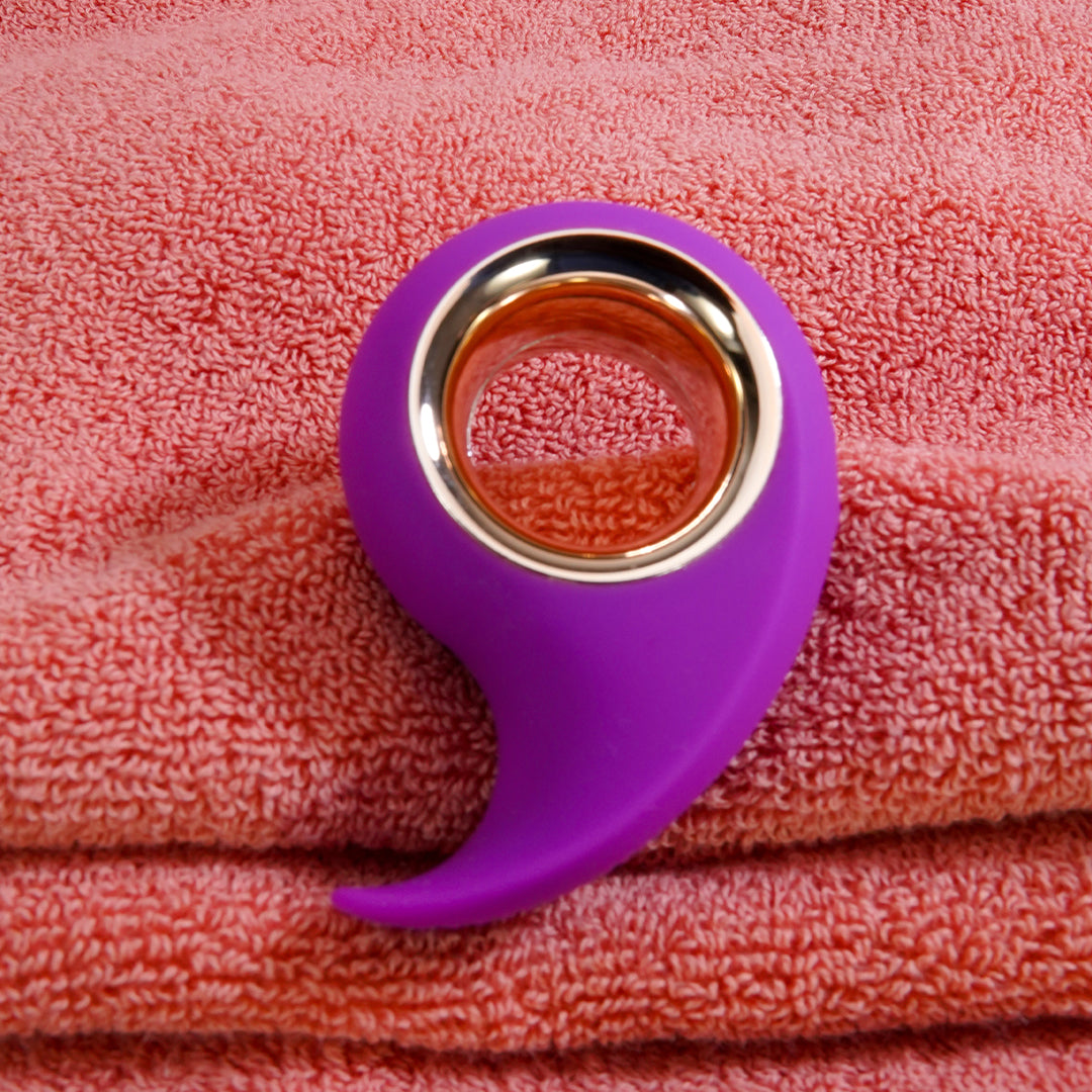 Purple Jodie Comma Clitoral Vibrator on Towels