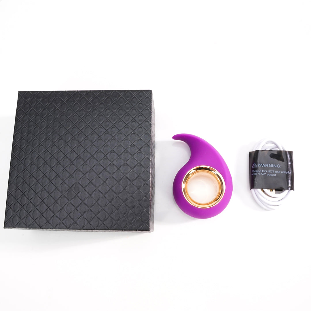Jodie Portable Comma Vibrator, product shot with accessories