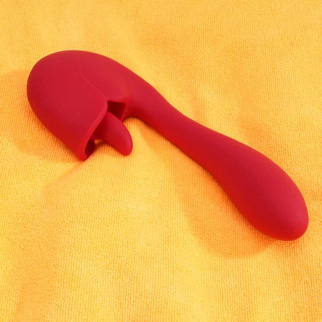 Red Leblanc Mini Suction AV Bar Vibrator on yellow towel