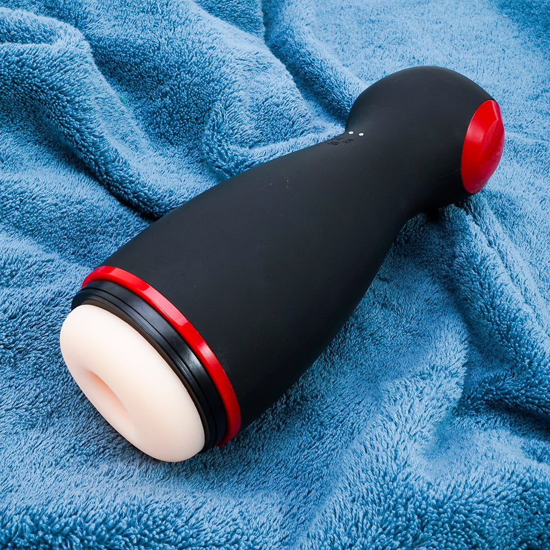 Black CIVI Suction Squeeze Vibrating Voice Masturbator on blue towel