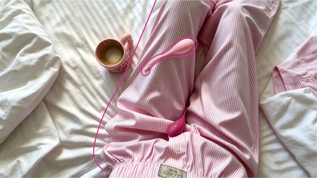 Pink pelvic exercise device on striped pajamas beside a coffee mug