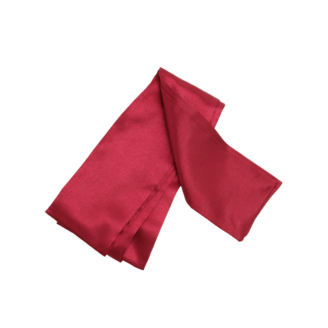 Deep red luxury satin fabric folded, material for eye mask.