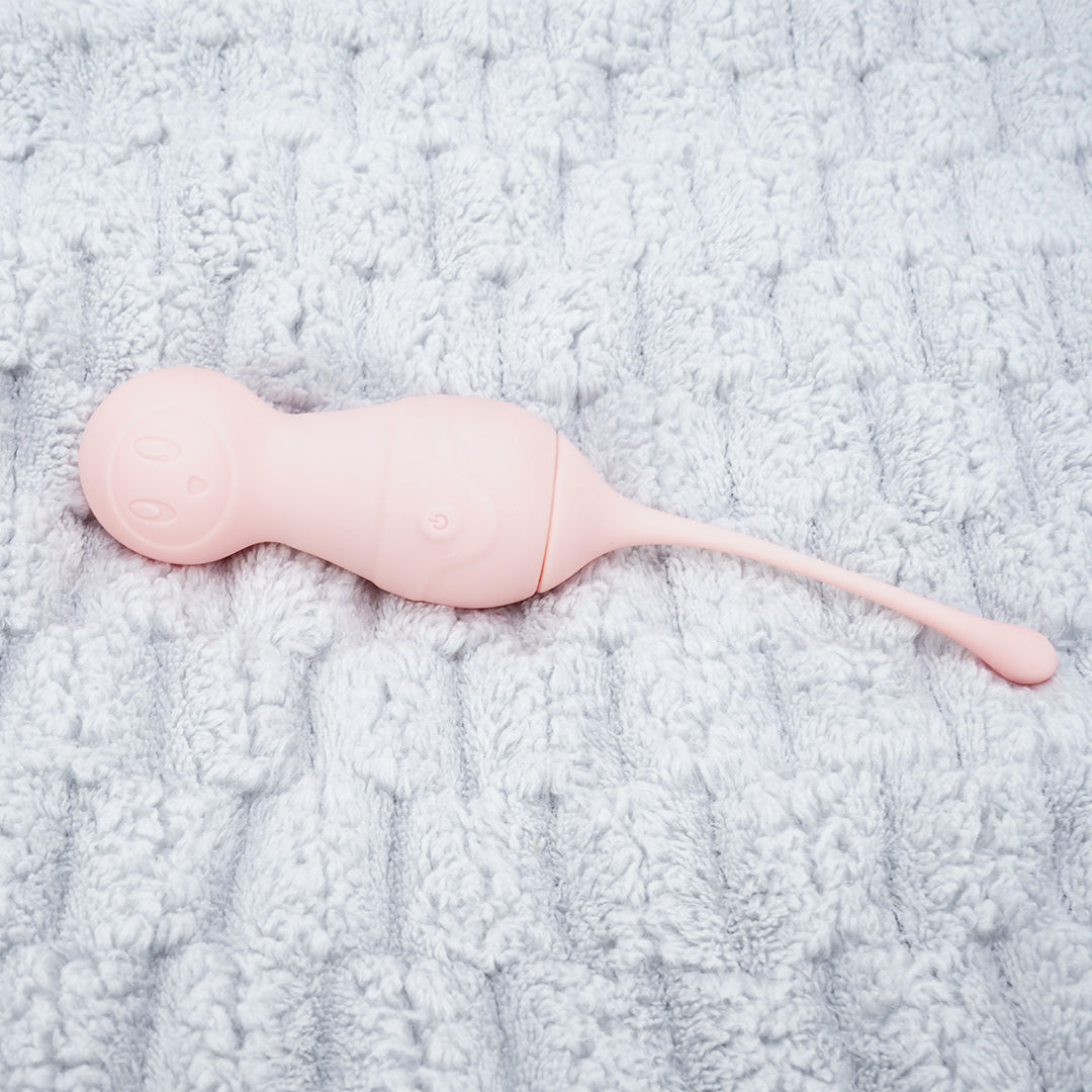Pink VAVA Female Vagina Massager Vibrator on gray background