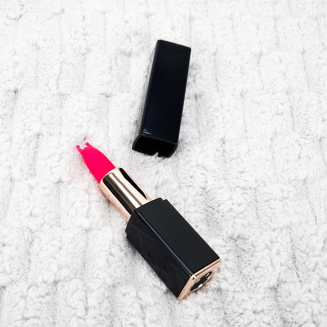 Angel's Kiss lipstick vibrator on white surface