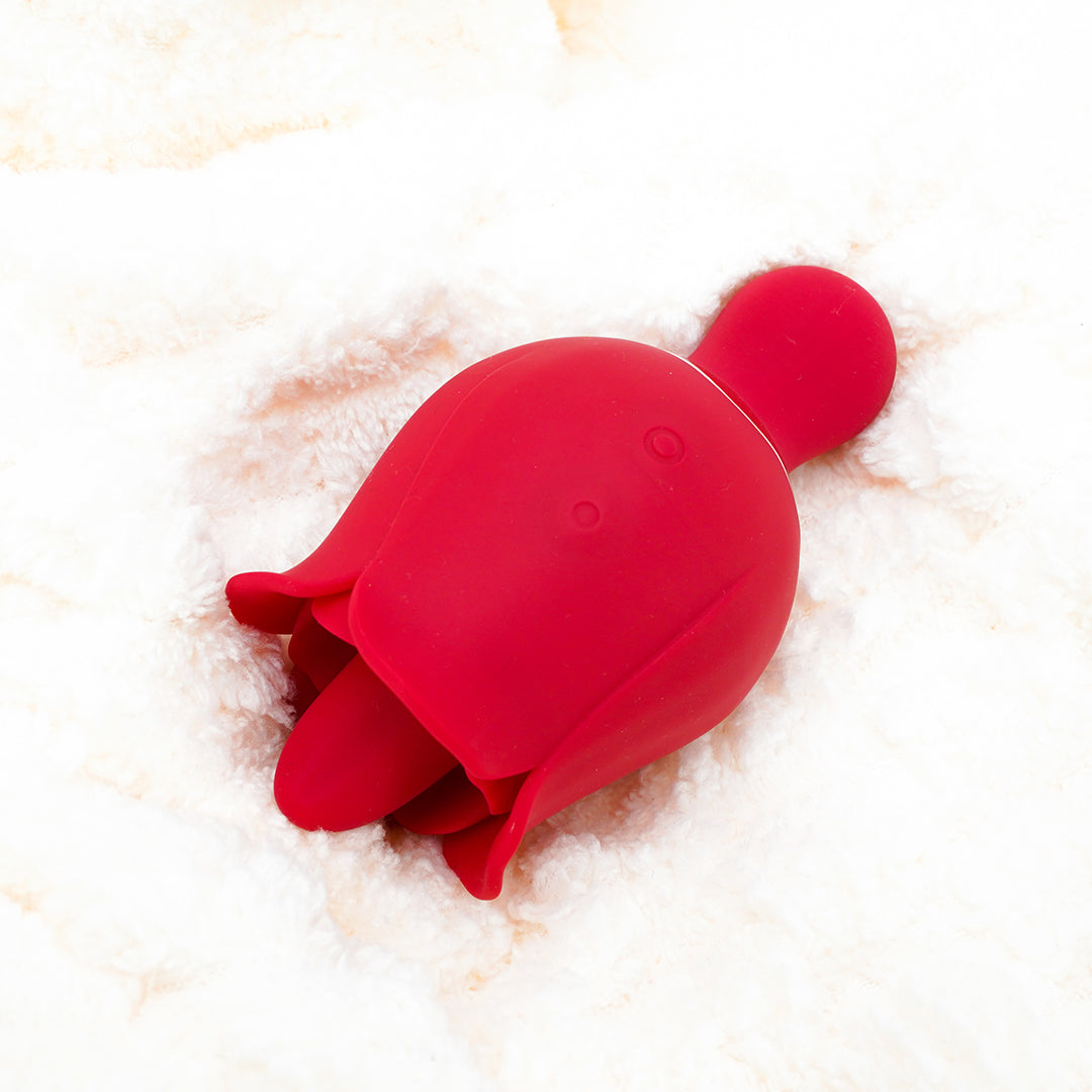 Red Rose Pro 3 clitoral suction stimulator on a soft surface
