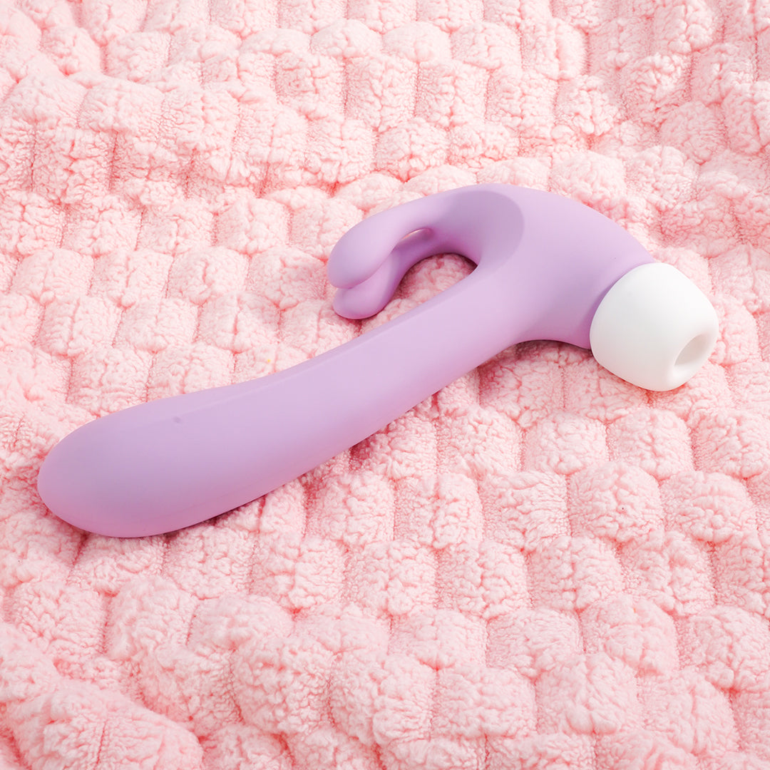 Purple Hammer Rabbit 3-in-1 Vibrator on pink towel